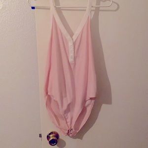 Pink and white body suit